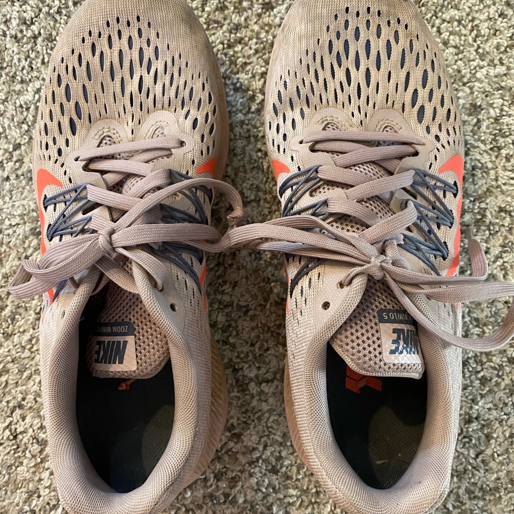 Nike lite pink tennis shoes. Have been worn and broken in. Size 7 1/2